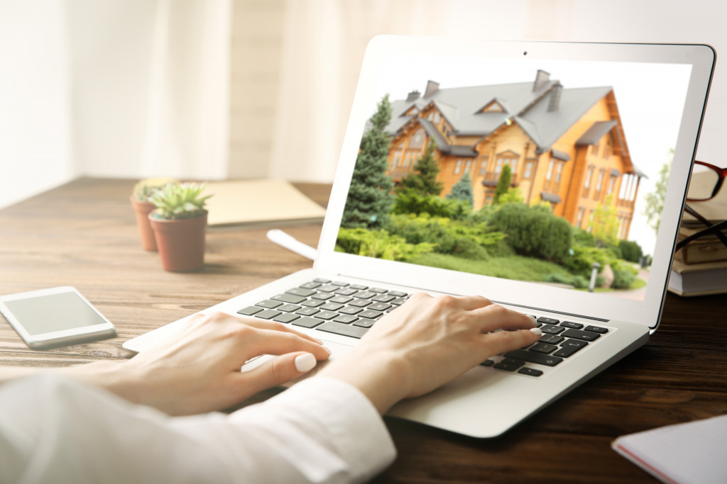 woman looking at property on her laptop